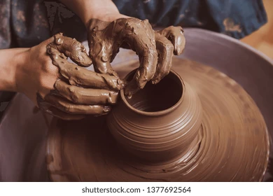 woman-hands-working-on-pottery-260nw-1377692564