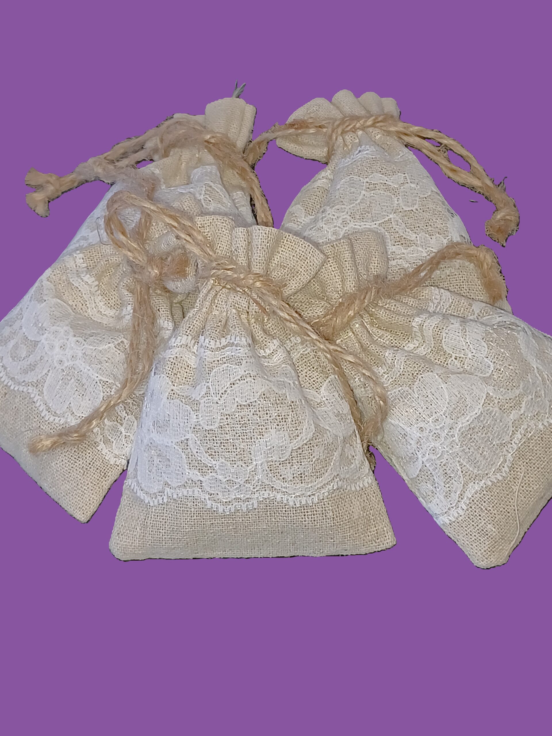 Three lace-trimmed lavender sachets.